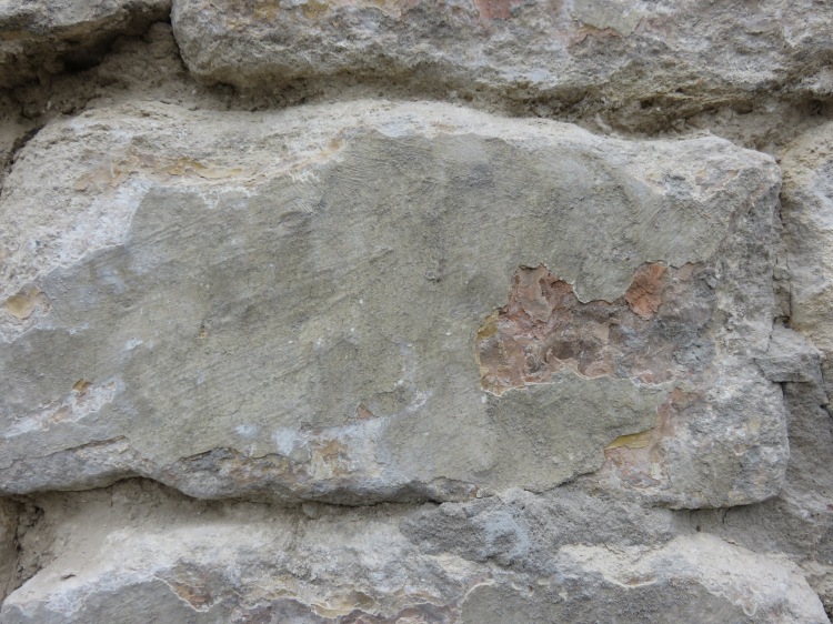 Cement left on stone face